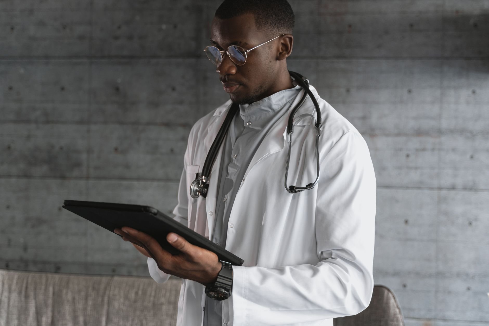 Healthcare professional reviewing information on a tablet